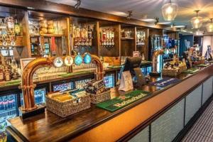 a bar with a counter with baskets of goods at Aurora Sky in Lossiemouth