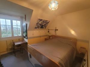 Ένα ή περισσότερα κρεβάτια σε δωμάτιο στο Maison de chantalle