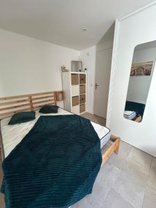 a bedroom with a large bed in a room at Two rooms with 30 m2 garden in villa in Cagnes-sur-Mer +22 photos