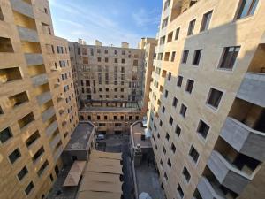 una vista aérea de dos edificios altos en una ciudad en Your Yerevan Home, en Ereván