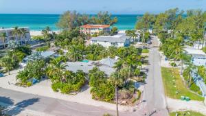 an aerial view of a resort with palm trees and the ocean at Anna Cabana Bungalow #1 in Holmes Beach