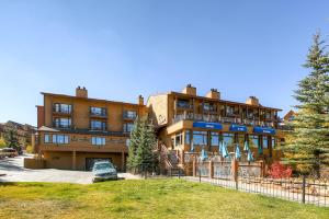 a building with a car parked in front of it at Der Steiermark 109 by Ski Country Resorts in Breckenridge