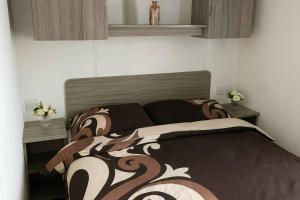 En eller flere senge i et værelse på Whitehouse Leisure Park - Holiday Accommodation 19055