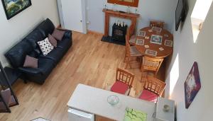 an overhead view of a living room with a couch and a table at Apartment Sleeps 7 with Mezzanine in Banagher