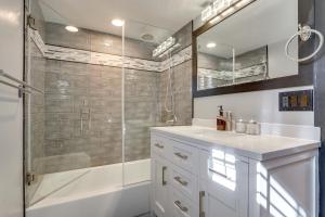 a bathroom with a shower and a sink and a mirror at Great Outdoor Space! Family Home in SLC Suburbs in Midvale +20 photos