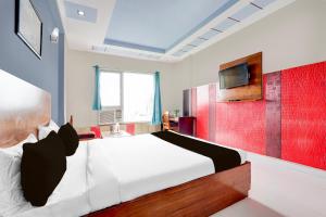 Ένα ή περισσότερα κρεβάτια σε δωμάτιο στο Collection O Taj Empire