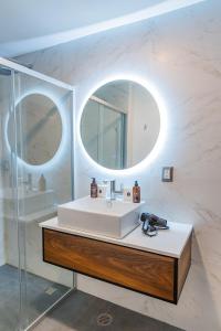 a bathroom with a sink and a mirror at Casa Castillo in Mexico City +108 photos