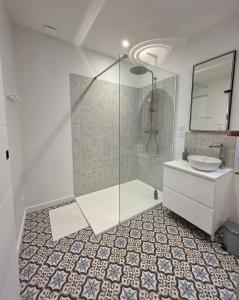 a bathroom with a shower and a toilet and a sink at L'évasion- Appartement cosy in Veuzain-sur-Loire