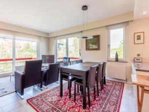 a dining room with a table and chairs at Aubépine premier in Sint-Idesbald