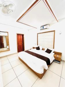 Ένα ή περισσότερα κρεβάτια σε δωμάτιο στο i7 HOMESTAY