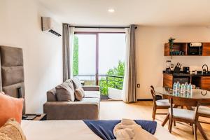 a living room with a couch and a table at Casa Castillo in Mexico City