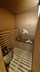 a sauna with a pair of sandals sitting in it at Gran Hotel Dakar in Mendoza +73 photos
