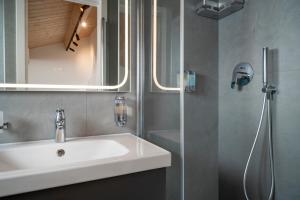 a bathroom with a sink and a shower at BOMA Prime Rooms in Civitanova Marche +48 photos