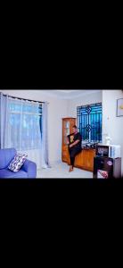 Ένα ή περισσότερα κρεβάτια σε δωμάτιο στο Devine Homes Apartments