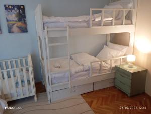 a room with two bunk beds and a night stand at CasaMamma in Drama