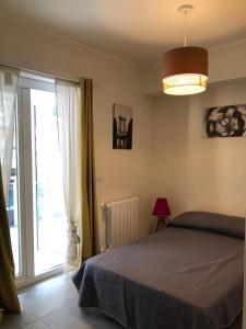 En eller flere senge i et værelse på Ammare apartament Milazzo