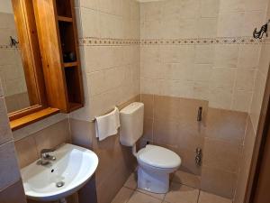 a bathroom with a toilet and a sink at Residence Les Lacs in Bardonecchia +39 photos