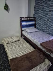 En eller flere senge i et værelse på Casa bem localizada na Cidade Nova