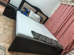 Ένα ή περισσότερα κρεβάτια σε δωμάτιο στο Safari Guest House