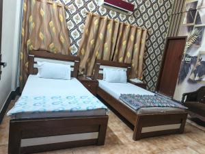 Ένα ή περισσότερα κρεβάτια σε δωμάτιο στο Safari Guest House