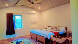 Postel nebo postele na pokoji v ubytování Blue Tree Resort