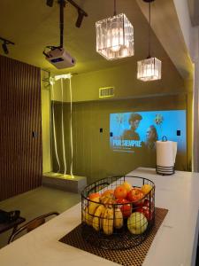 a basket of fruit on a table in a room at Amber Apartment at Downtown in Chihuahua +25 photos