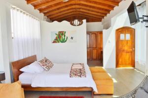 Postel nebo postele na pokoji v ubytování Hotel y Restaurante Miconia