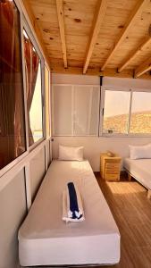 Ένα ή περισσότερα κρεβάτια σε δωμάτιο στο Tourma House