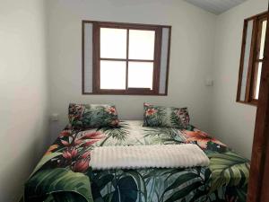 Ένα ή περισσότερα κρεβάτια σε δωμάτιο στο Atau Fare CK