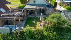 an overhead view of a backyard with a swimming pool at "ZeeLandZon" Holiday home by the lake with Jacuzzi and Sauna in Herkingen