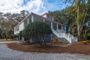 a large white house with a tree in front of it at Misty Lane in Edisto Island