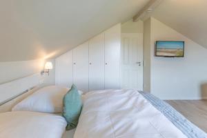 Ένα ή περισσότερα κρεβάτια σε δωμάτιο στο Fischerhuus