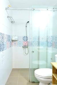 a bathroom with a shower and a toilet at Heart Of Hoan Kiem RARE 4BR large cozy private house center max 14pax in Hanoi +74 photos