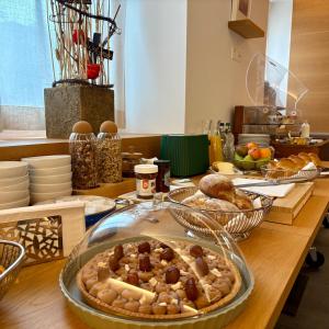 a table with a plate of food on top of it at Locanda Marco in Bellinzona