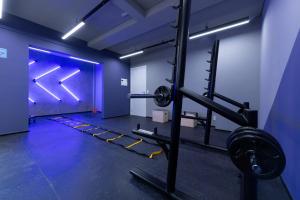 a room with a gym with two tread machines at Lar Longe de Casa in Sao Paulo