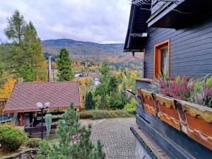 a house with a balcony with a view of the mountains at Family Relax Widoki in Szczyrk +37 photos