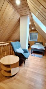 a room with a couch and a table and a bed at Ferienhuette in Altfriesack