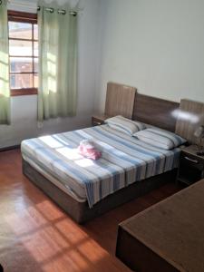 Postel nebo postele na pokoji v ubytování Apartamento inteiro no centro - 1 cama casal e solteiro, fronteira Brasil-Uruguai