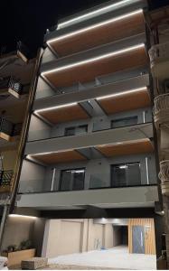 a building with a lot of windows on it at EmmeleiaLuxuryStudio in Xanthi +26 photos