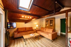 TV a/nebo společenská místnost v ubytování Chalet Four Seasons