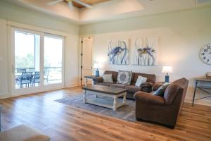 a living room with a couch and a table at NEW St George Island Home wPrivate Pool in Eastpoint +50 photos