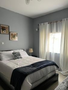 Ένα ή περισσότερα κρεβάτια σε δωμάτιο στο B01 Laxia Appartment +11 φωτογραφίες