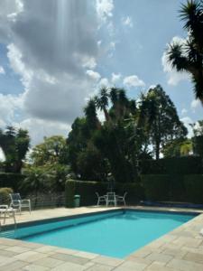 Bazén v ubytování Quarto De Luxe Silver nebo v jeho okolí