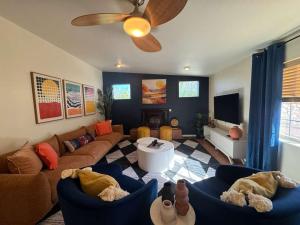 a living room with a couch and a tv at White Sands NP Retreat in Alamogordo