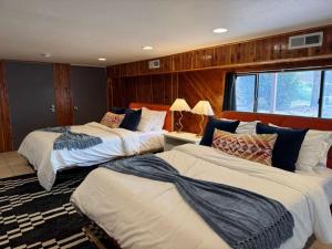 a hotel room with three beds in a room at White Sands NP Retreat in Alamogordo