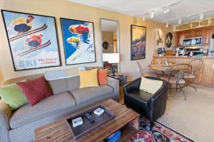 a living room with a couch and a table at Highland House 119 Next To Slopes Trails WiFi In Village With A View in Snowshoe