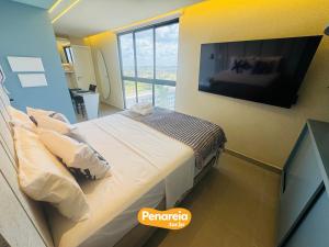 En eller flere senge i et værelse på EMUNAH DI CITTÀ Flats Ponta de Campina + 156 billeder