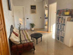 a living room with a chair and a table at Apartment Private room in apartment in Khouribga in Khouribga
