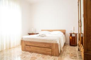 Ένα ή περισσότερα κρεβάτια σε δωμάτιο στο Casa Maria 'e Mimì