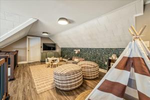 a living room with two couches and a tv at Long Pond Lakeside Kayaks Hot Tub Playground in Emerald Lakes +79 photos